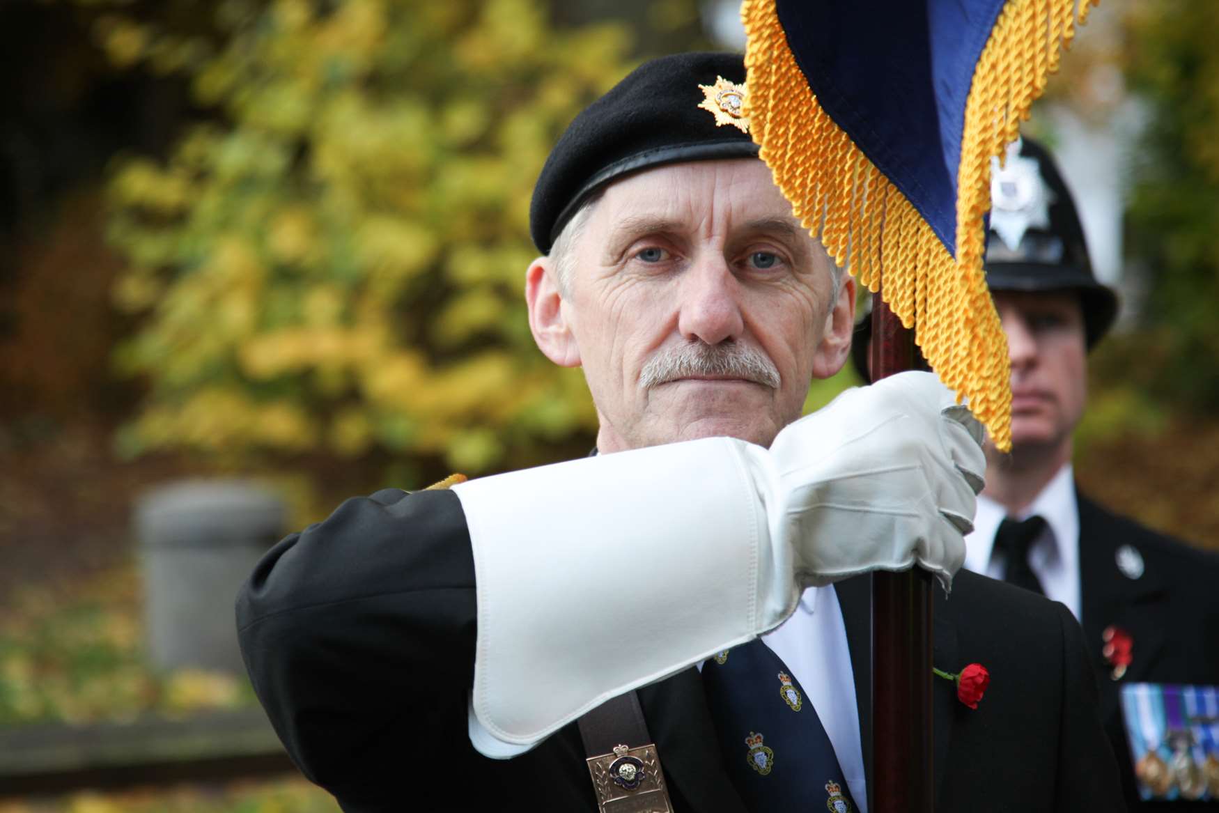 A man holds the RBL standard