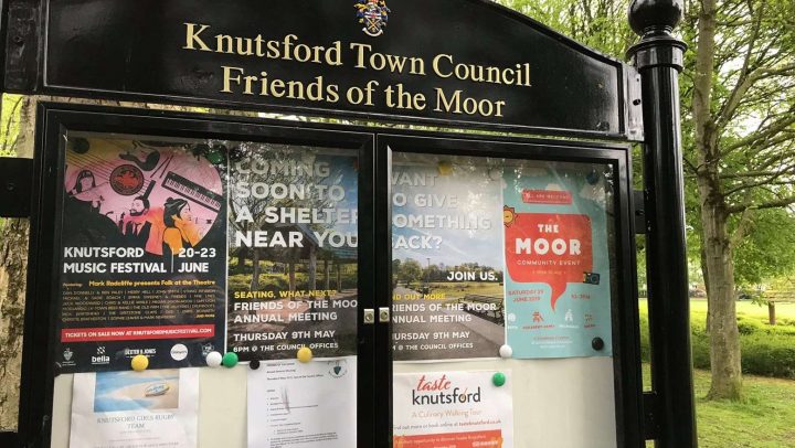 A noticeboard full of posters