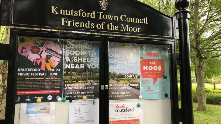 A noticeboard full of posters