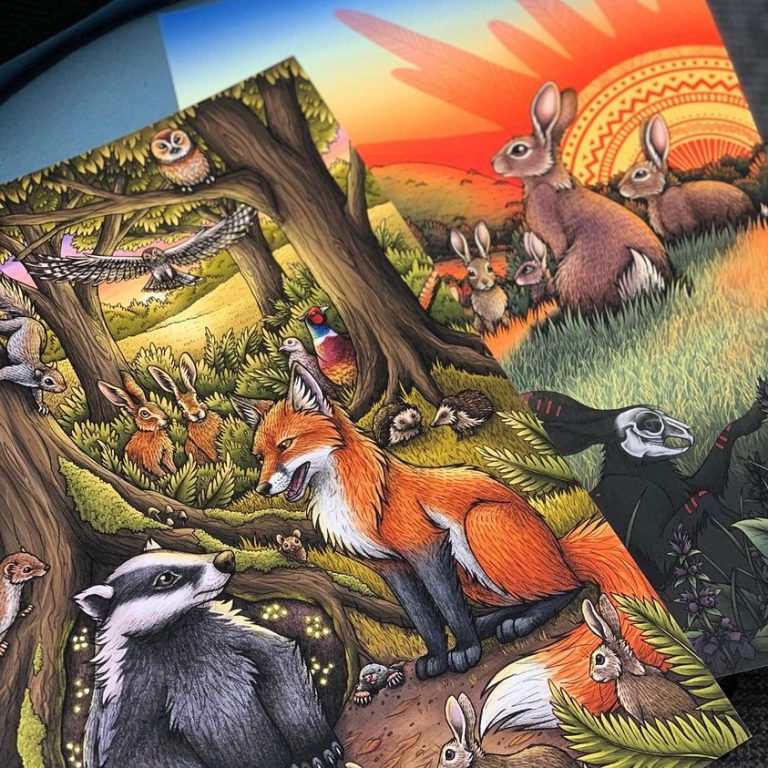 A close up of two animal related art prints