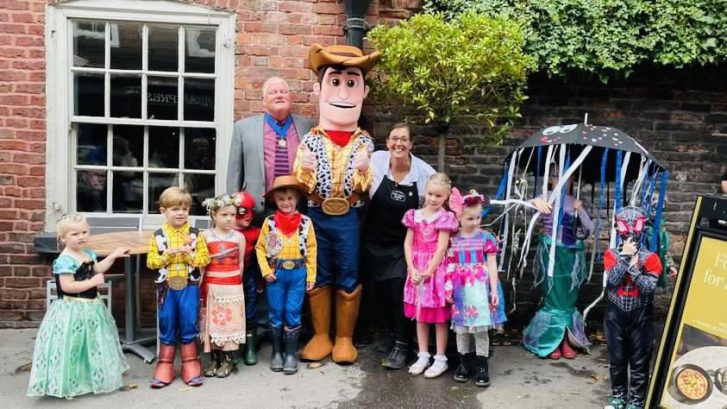 The mayor and Woody with a group of people