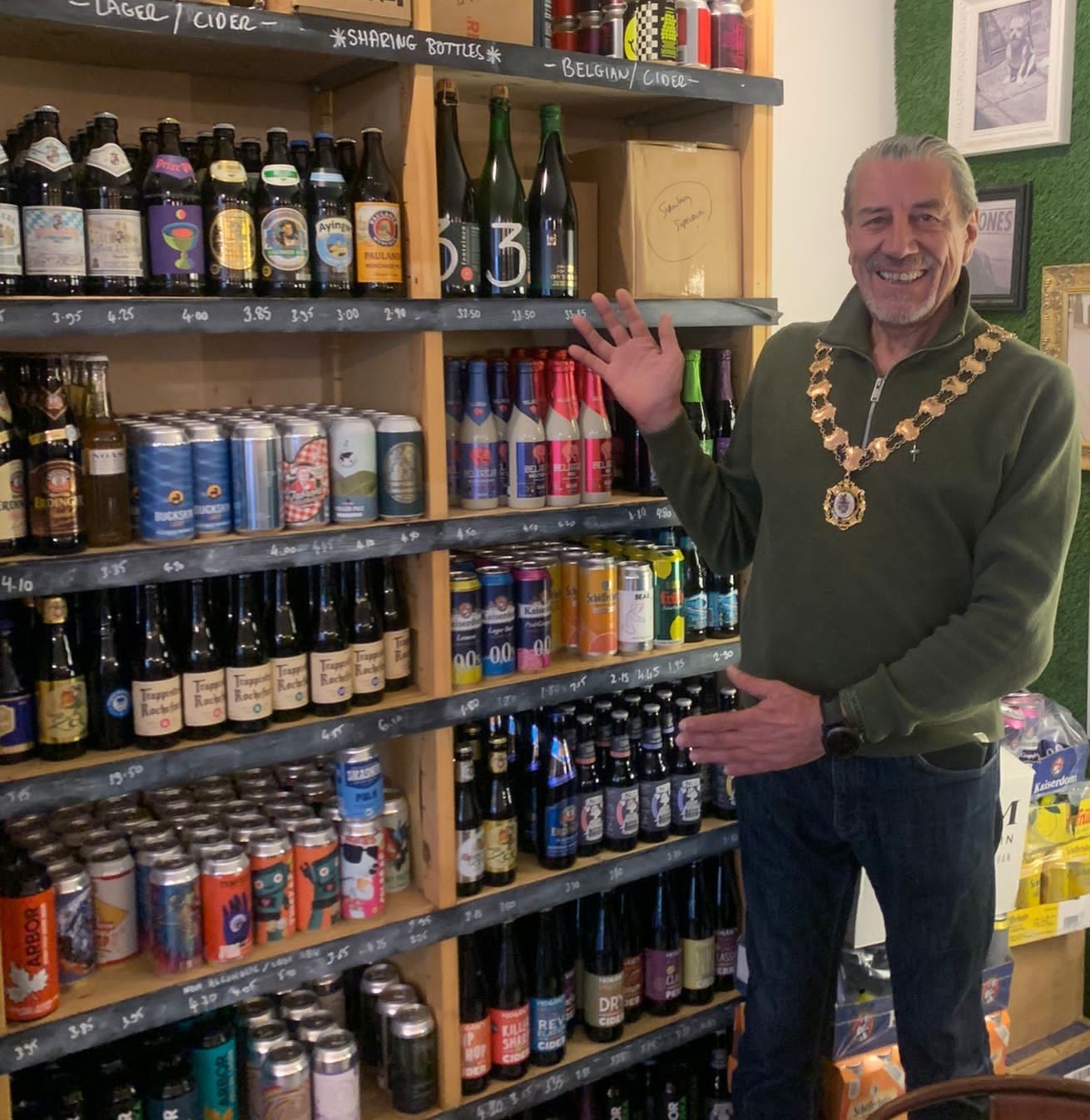 Mayor stood next to a selection of beers