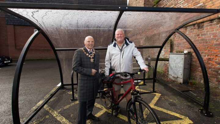 Cllr Hartley and Cllr Banks (with his bike) in the new shelter