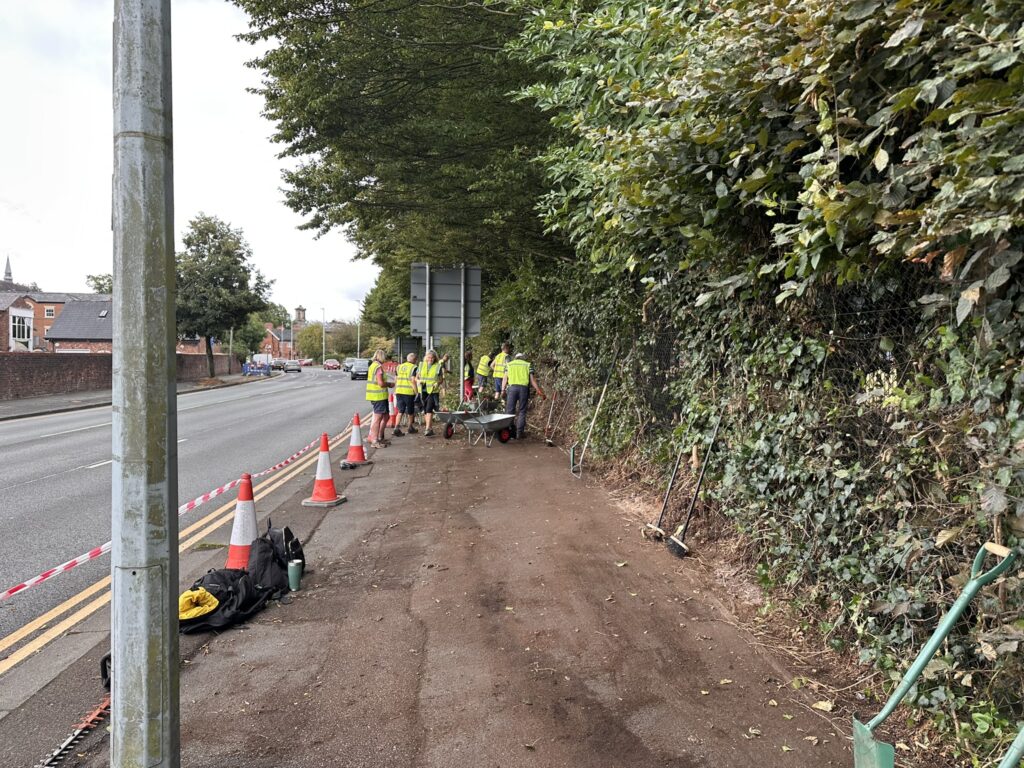 A group of people clearing a footway