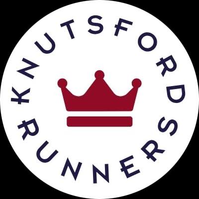 The logo for Knutsford Runners, showcasing a red crown icon and the name prominently displayed in a circle around it.