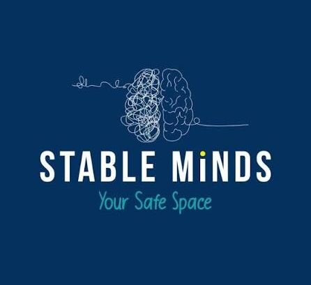 Blue background, a white squiggle to look like a brain, with STABLE MINDS underneath, followed by 'Your Safe Space' in a soft blue.