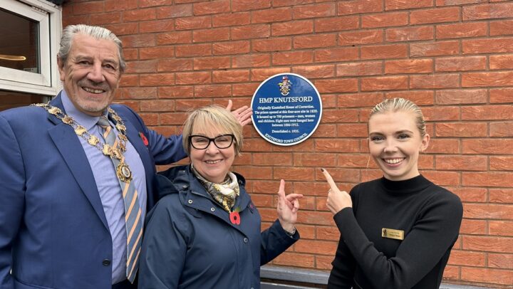 Town Mayor, Jenny Collis and Booths Assistant Manager with the blue plaque