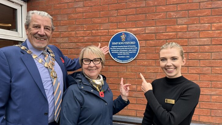 Town Mayor, Jenny Collis and Booths Assistant Manager with the blue plaque
