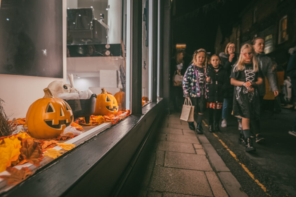 A group of pumpkins in a shop window